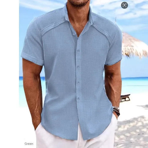Hawaiian casual short sleeve solid colour shirt in a cotton blend fabric on a hanger.