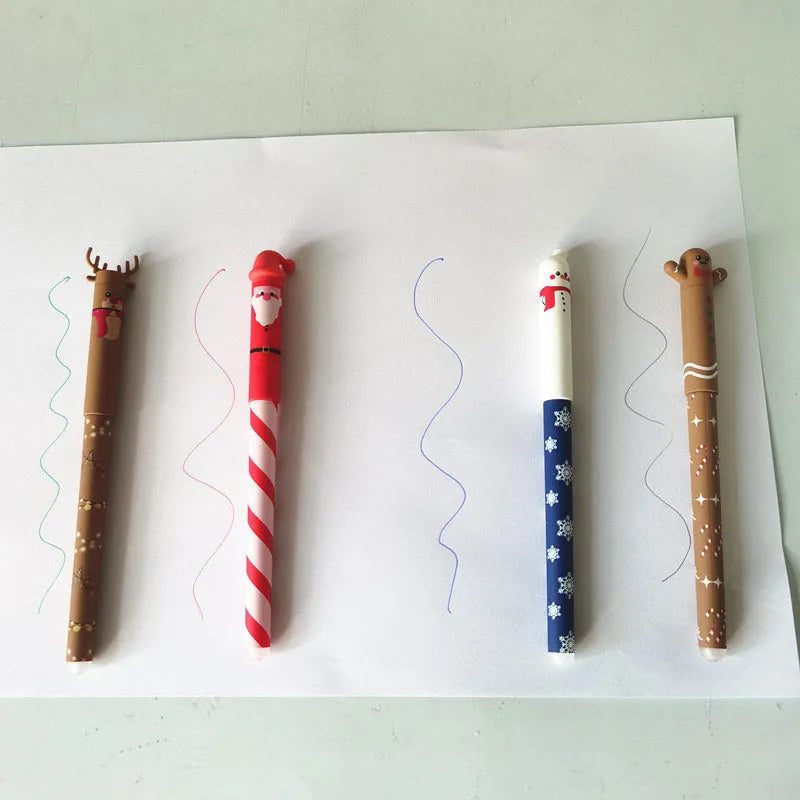 Four erasable gel pens in red, black, green, and blue with Christmas themes on a white background