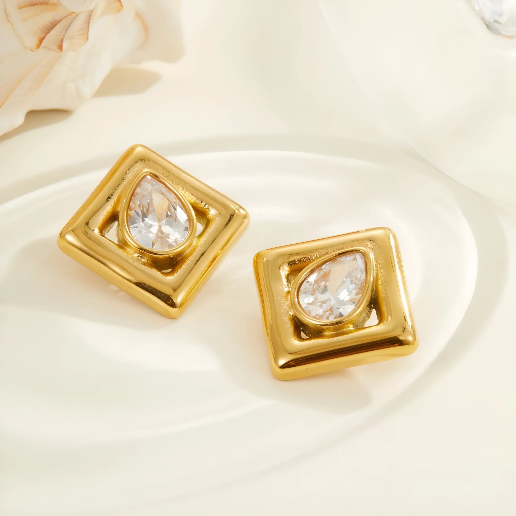 Gold geometric water drop zircon stud earrings with butterfly back fastenings