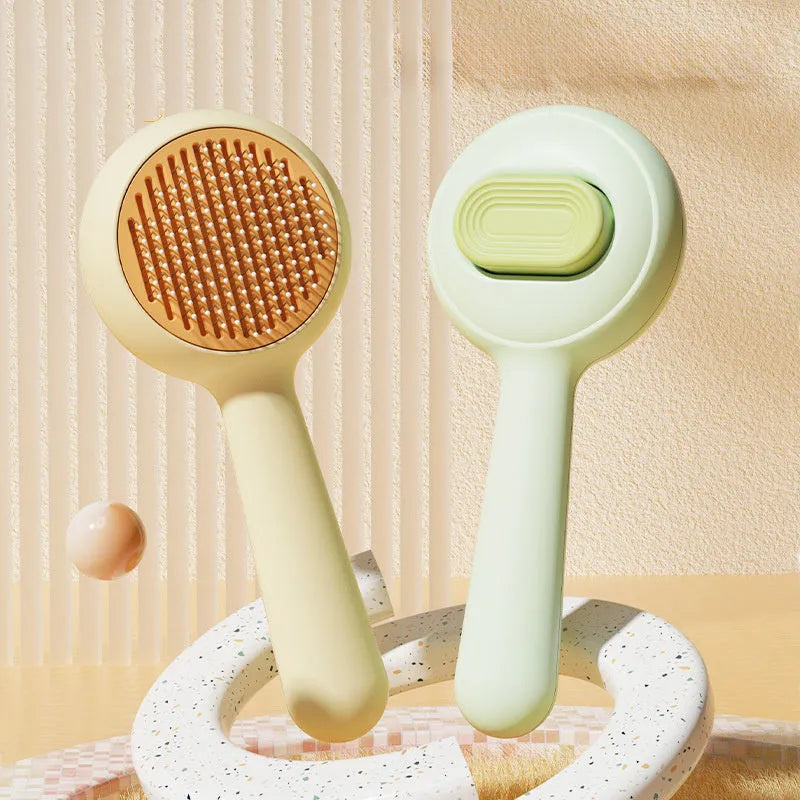 Green and yellow pet grooming brushes with stainless steel pins and non-slip handles on a white background.