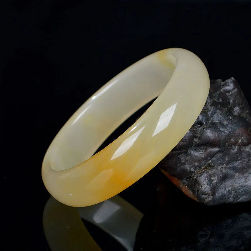 Natural light jade bracelet with Chinese styling in polished gemstone finish showing adjustable sizing from 54mm to 62mm