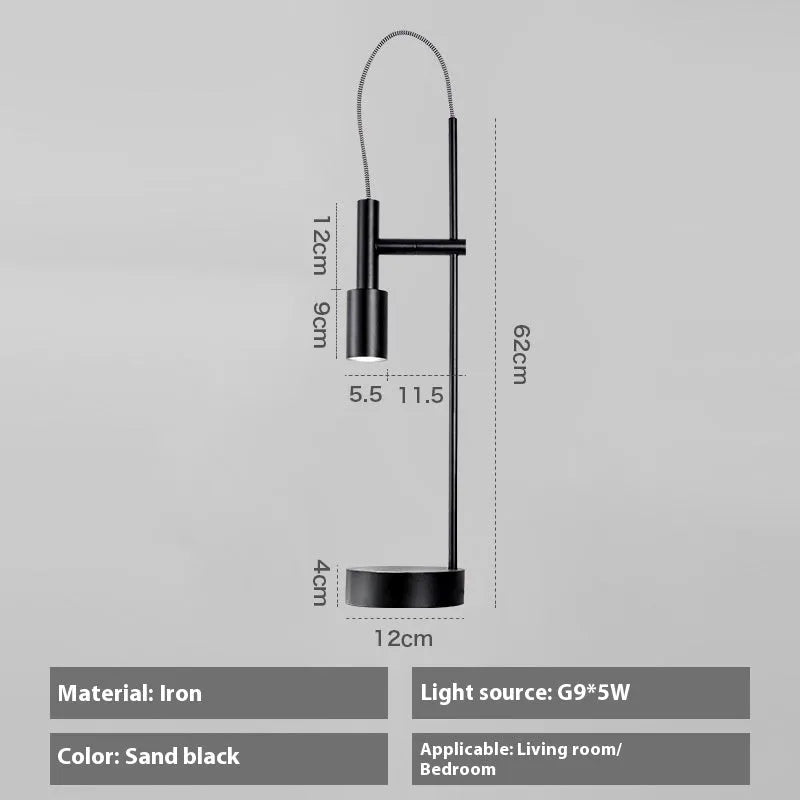 Simple modern rotating table lamp in sand black finish with wrought iron base and G9 bulb, suitable for bedside use