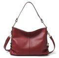 Genuine leather vertical square crossbody bag showing internal phone and document pockets