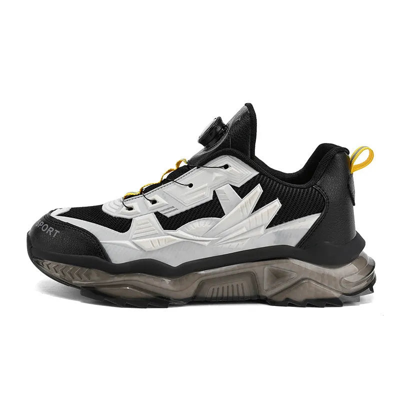 Men's black casual shoes with a rotating button closure and mesh upper on a rubber sole.