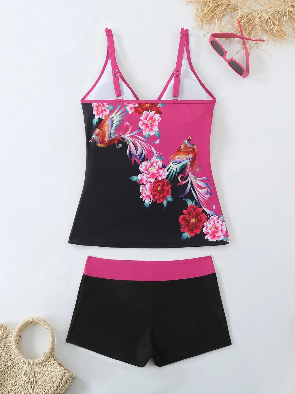 Plus size black printed swimsuit briefs for women on a hanger.