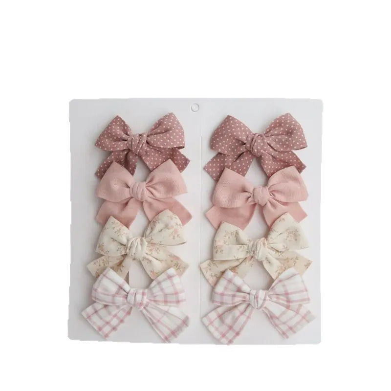 Children's eight-piece cloth bow hairclip set in dovetail shape with multiple colour options