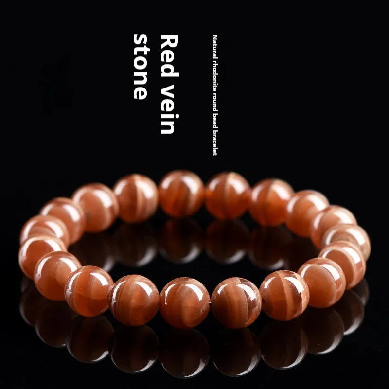 Natural old mine rhodochrosite round beads bracelet from Peru in 6mm or 8mm sizes with Ruyi elements