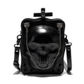 Black mini square crossbody bag with skull embossing, chain detail, and metal rivets on a vertical PU leather messenger bag.