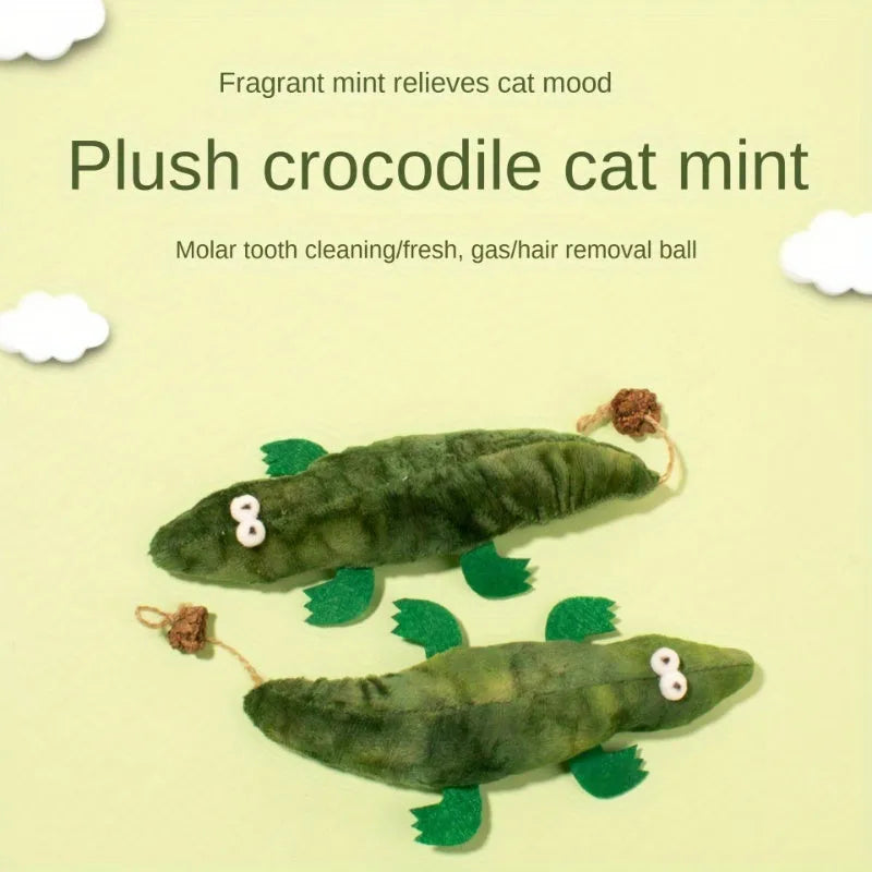 Green plush alligator catnip toy made from cotton fabric on a plain background.