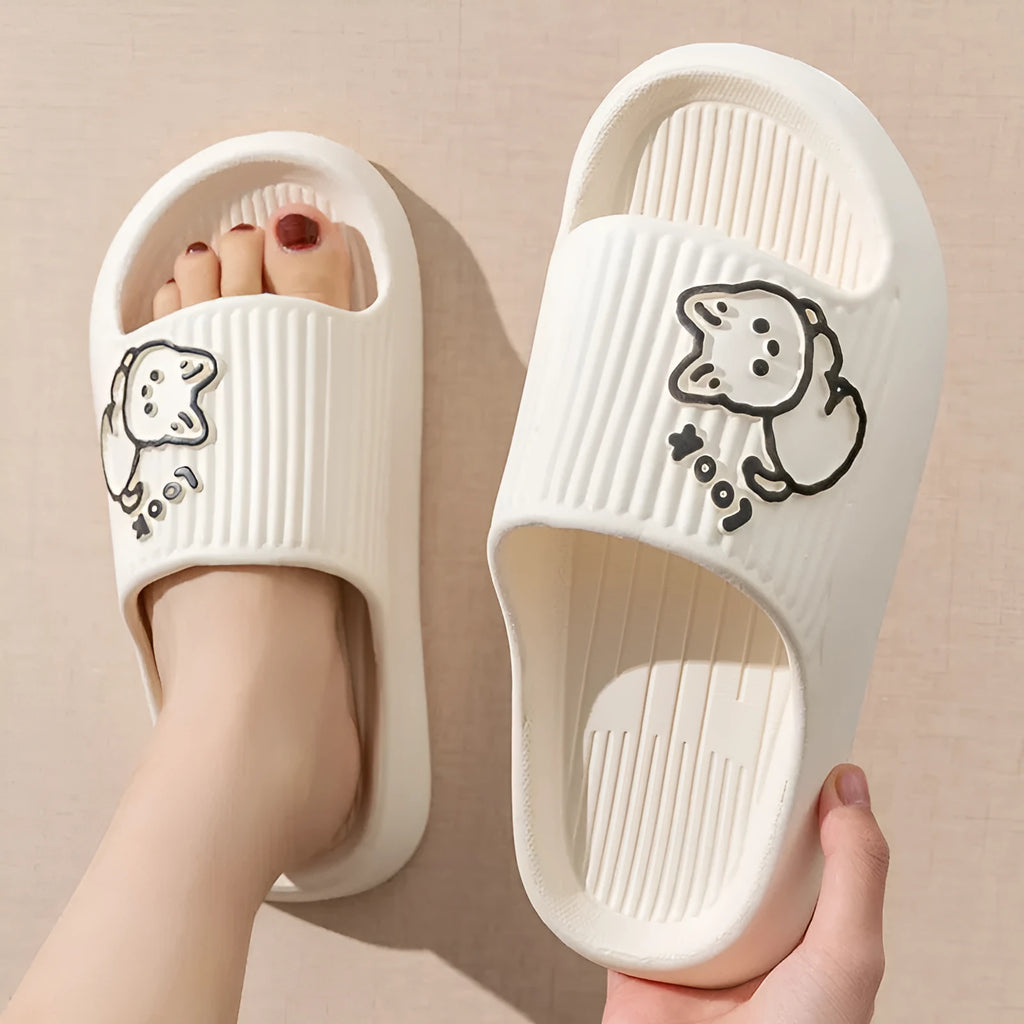 Green cat design thick EVA platform slippers on a wooden floor