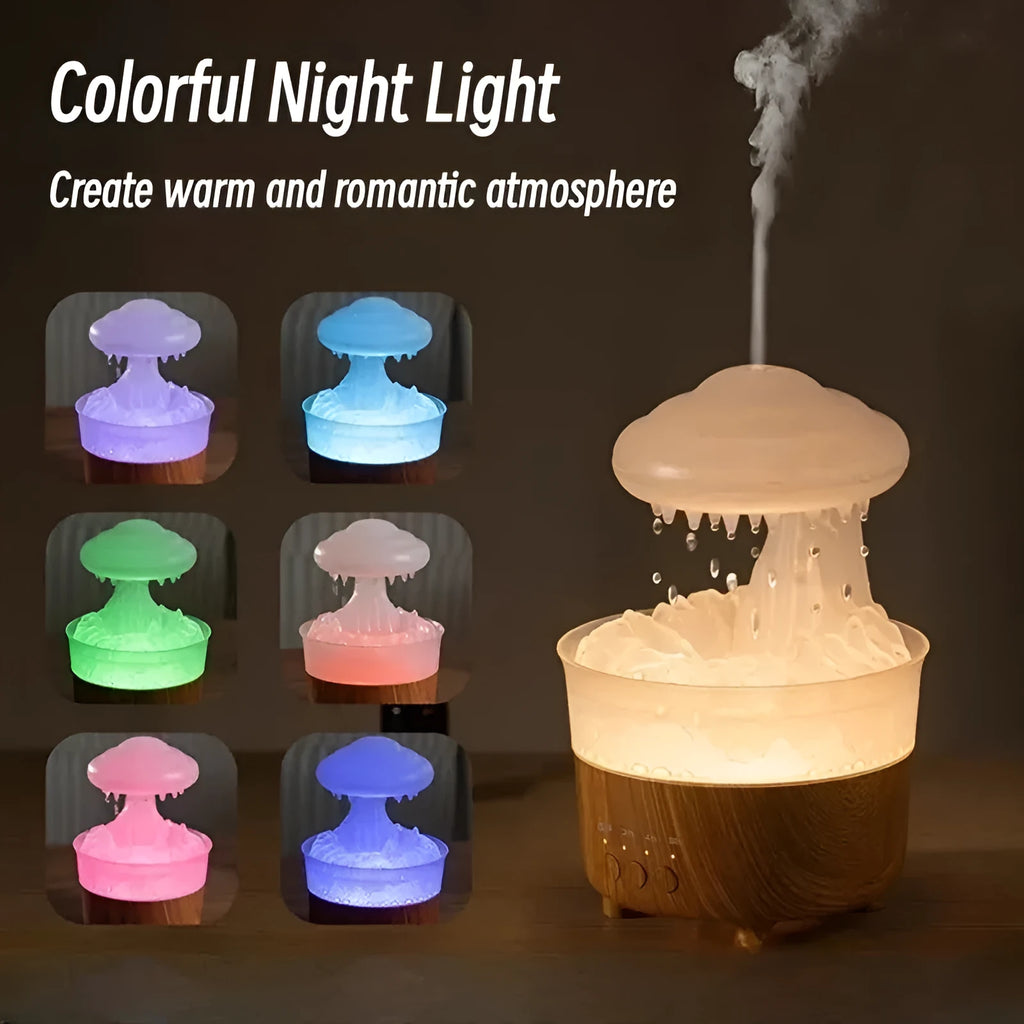 Wood grain white rain cloud shaped humidifier and essential oil diffuser with LED lights on a table.