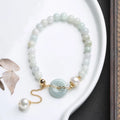 Emerald jade and pearl bracelet with peace symbol buckle on adjustable 20-22cm band