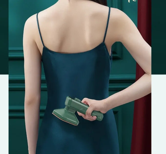 Dark green portable hanging ironing machine with ceramic panel and sharp corner design for travel use