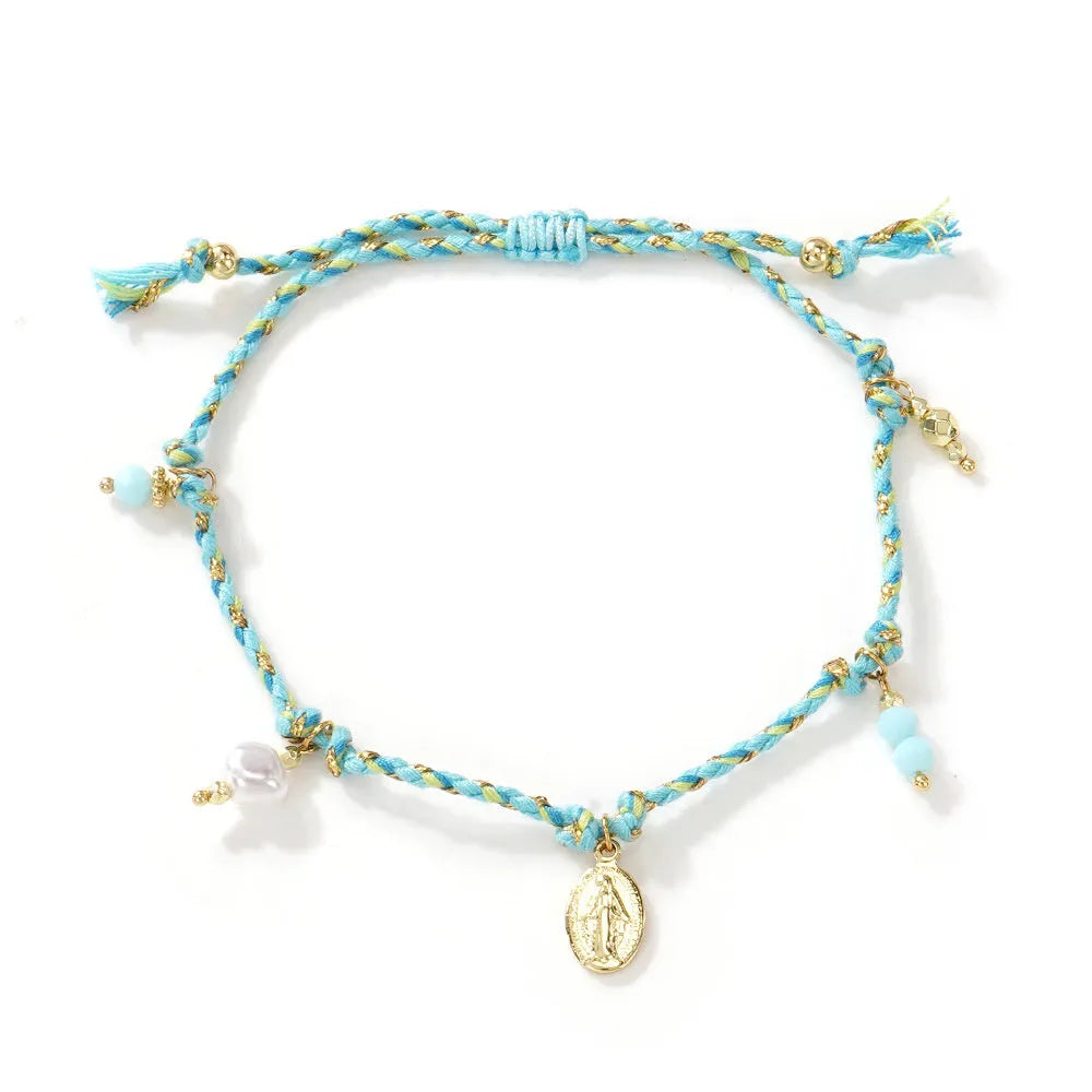 Close-up of a hand-woven colourful braided rope bracelet for women with a carrying strap tag.