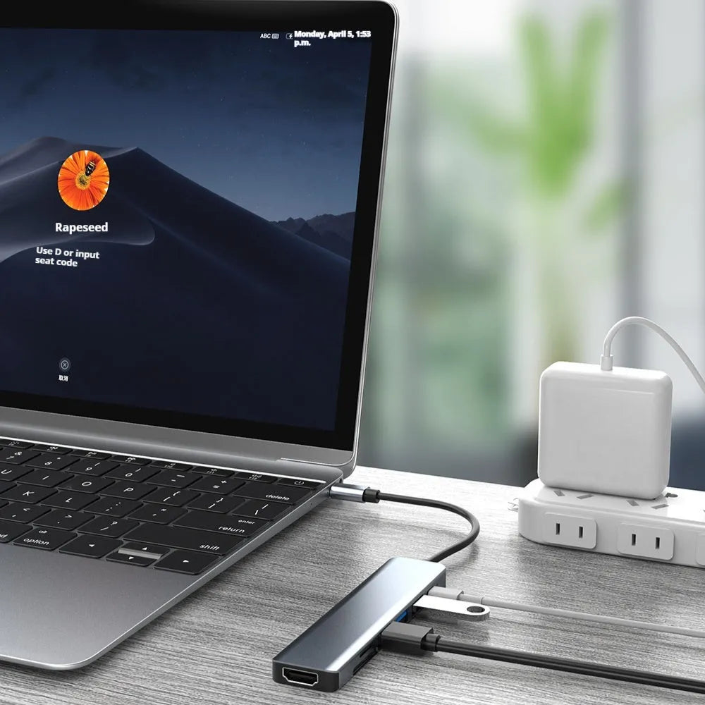 Seven-port Type-C USB expander hub with HDMI, USB ports, SD slots, and 0.145m cable for laptop connectivity