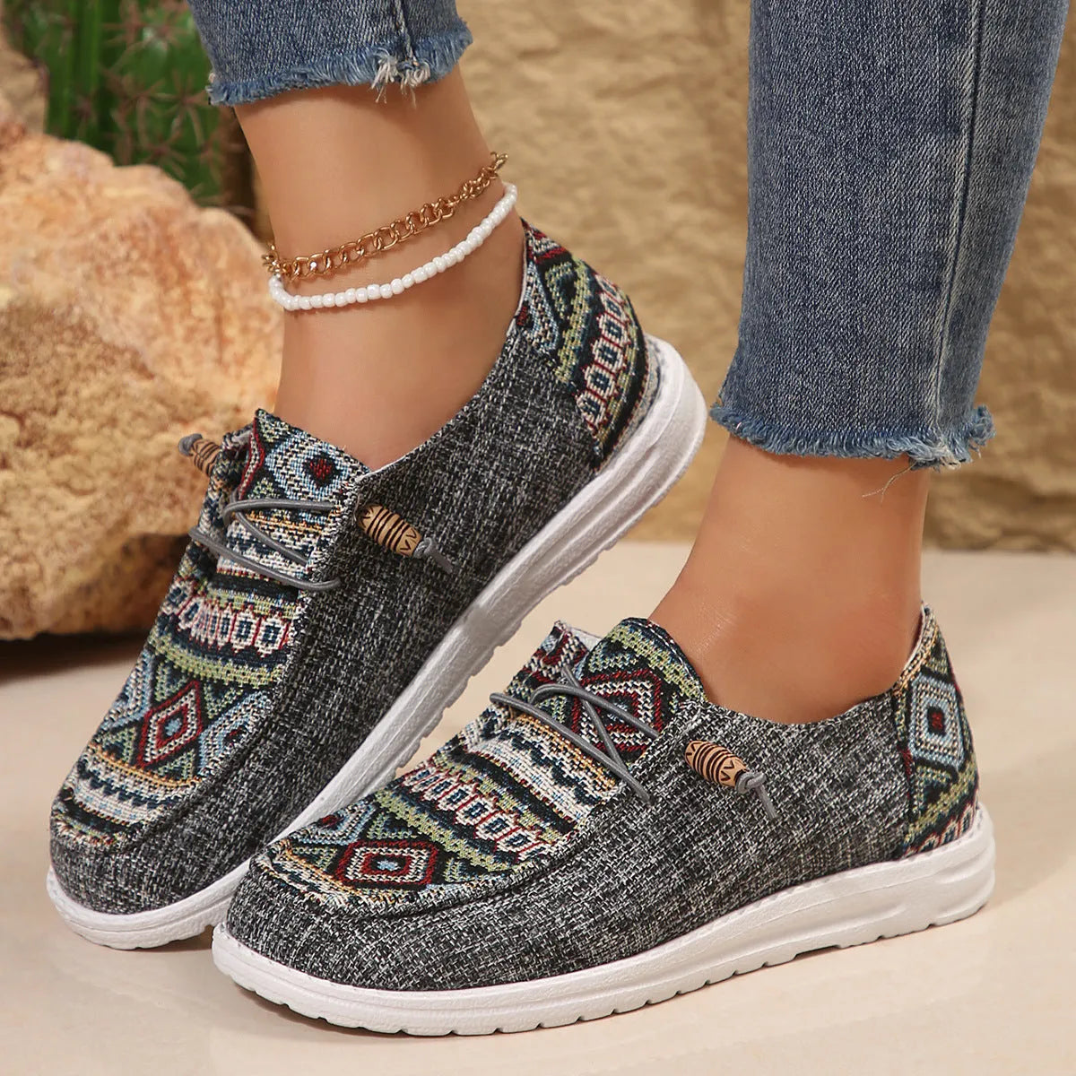 Women's flat round toe shoes in black, dark grey, and khaki with a low-top design and rubber sole.