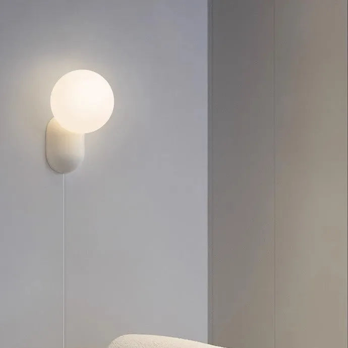 Nordic bedside wall lamp in black with acrylic shade and resin body