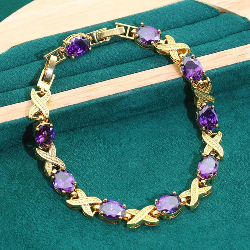 18k gold plated zircon jewellery set showing necklace, earrings, bracelet, and ring with sparkling cubic zirconia stones