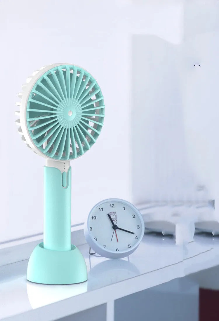 Blue portable USB electric fan with oscillation function and three-speed control on desktop