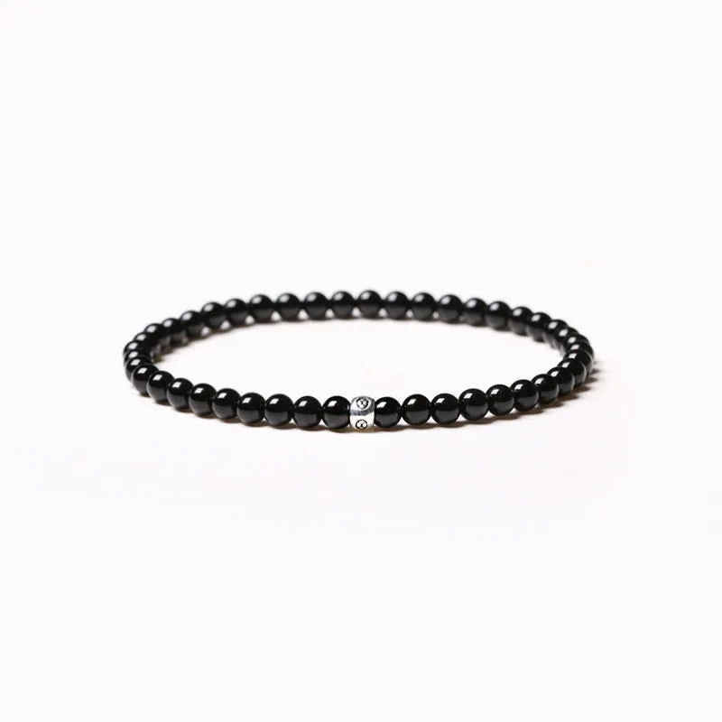 Unisex geometric agate bracelet with 4mm electroplated beads in obsidian black and blue san colours