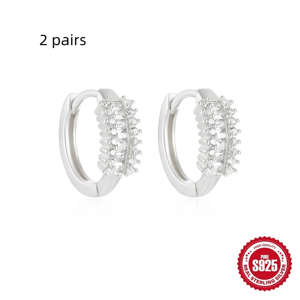 Sterling silver geometric stud earrings with diamond detailing in gold or silver finish