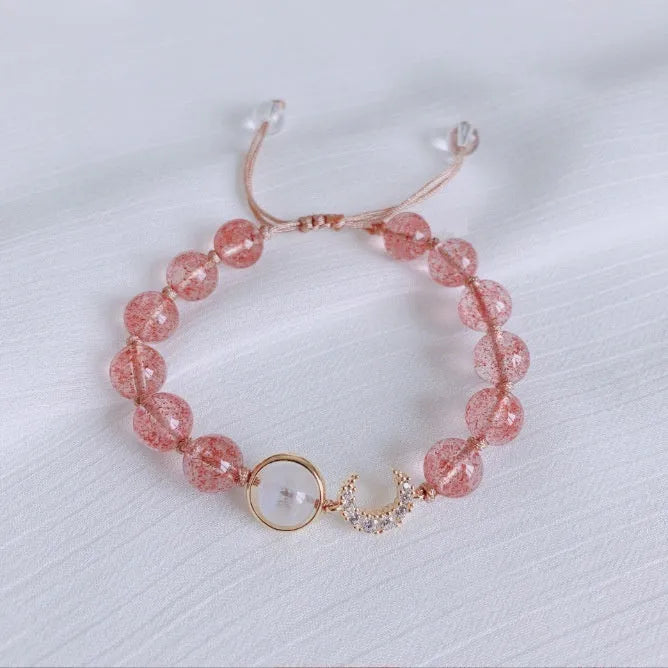 Handcrafted strawberry quartz crystal bracelet with green moon beads and peach blossom Hetian jade charm on adjustable string