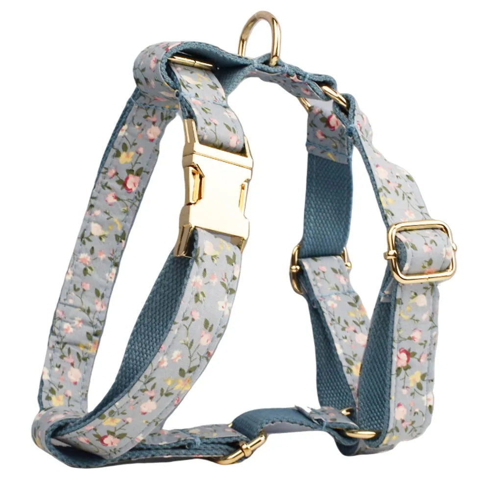 Floral polyester cotton dog collar set with matching leash, vest, bow, and poop bag accessories