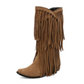 Women's suede knee-high boots with tassel, square toe, chunky heel and platform sole in beige.
