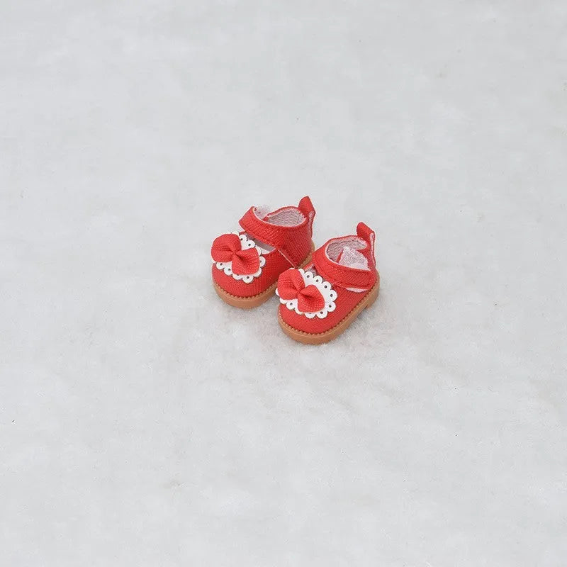 Set of miniature doll replacement shoes in various styles and colours for 17cm scale figures.
