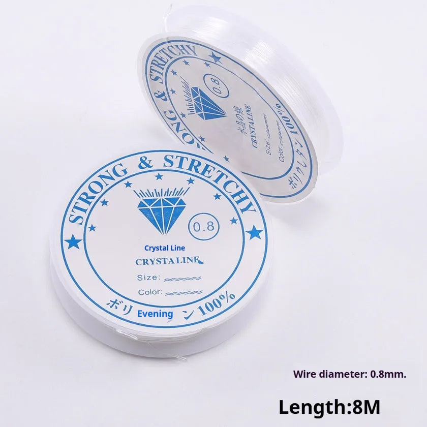 Transparent white elastic fishing line on spool for jewellery making and DIY crafts