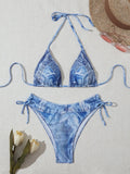 Women's blue denim print strappy bikini set, two-piece swimsuit on a white background.