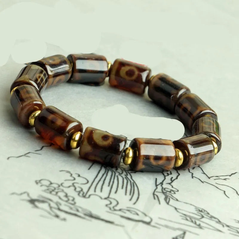 Agate Tibetan dzi bead bracelet with three-eye design and polished finish
