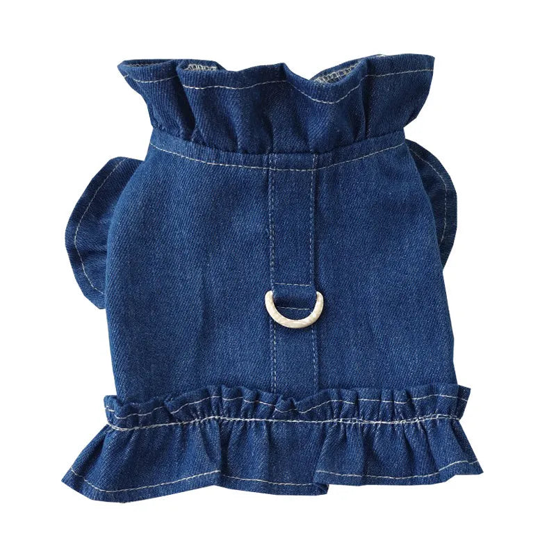Blue denim dog dress vest with ruffles and a metal leash hook on the back for small dogs.