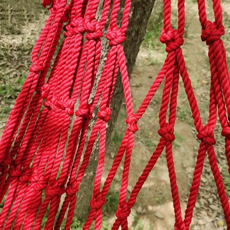 Nylon rope mesh hammock hung between trees showing 1.1m width