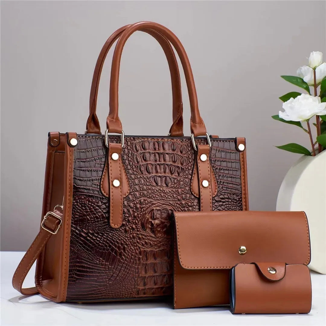Contrast colour three-piece PU bag set showing crossbody bag, wallet, and card holder in burgundy.