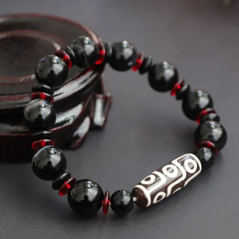 Hand-woven black agate and chalcedony dzi bead bracelet with geometric pattern