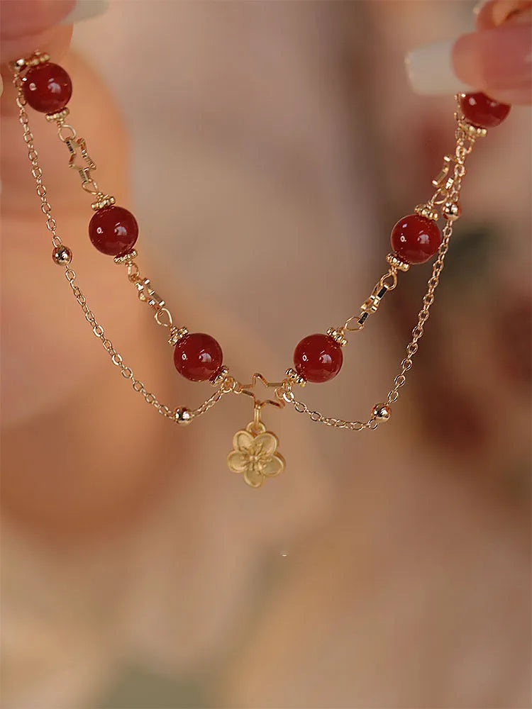 Handmade double layer red agate bracelet with peach blossom and flower design for women.
