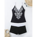 Plus size black printed swimsuit briefs for women on a hanger.