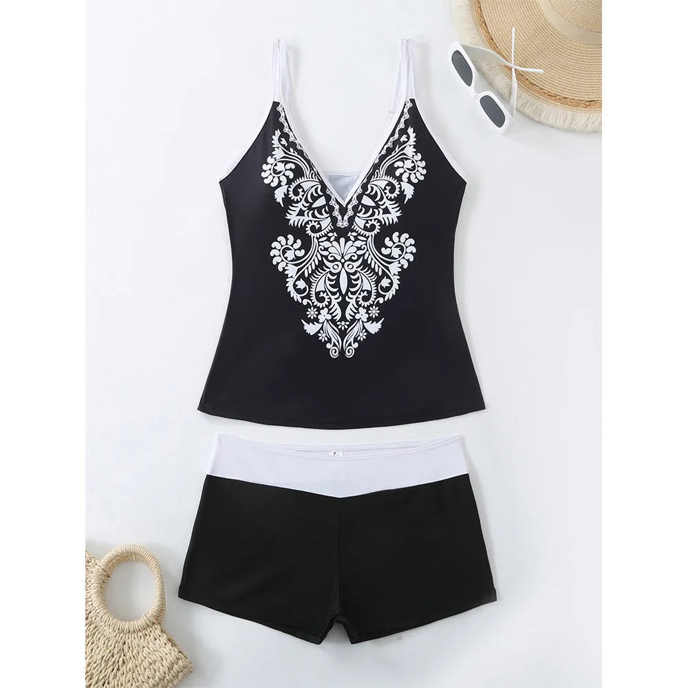 Plus size black printed swimsuit briefs for women on a hanger.