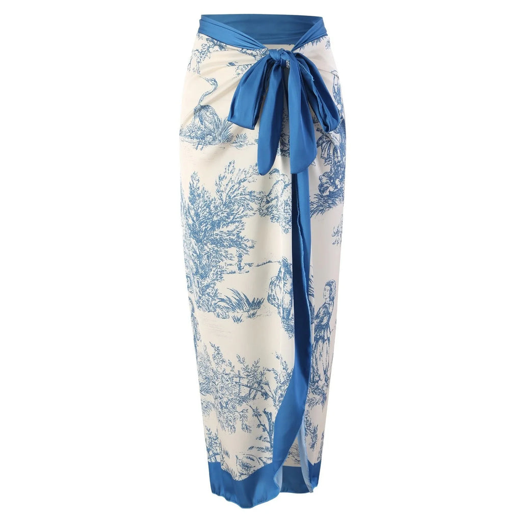 Blue patterned women's one-piece swimsuit with matching gauze skirt on size chart