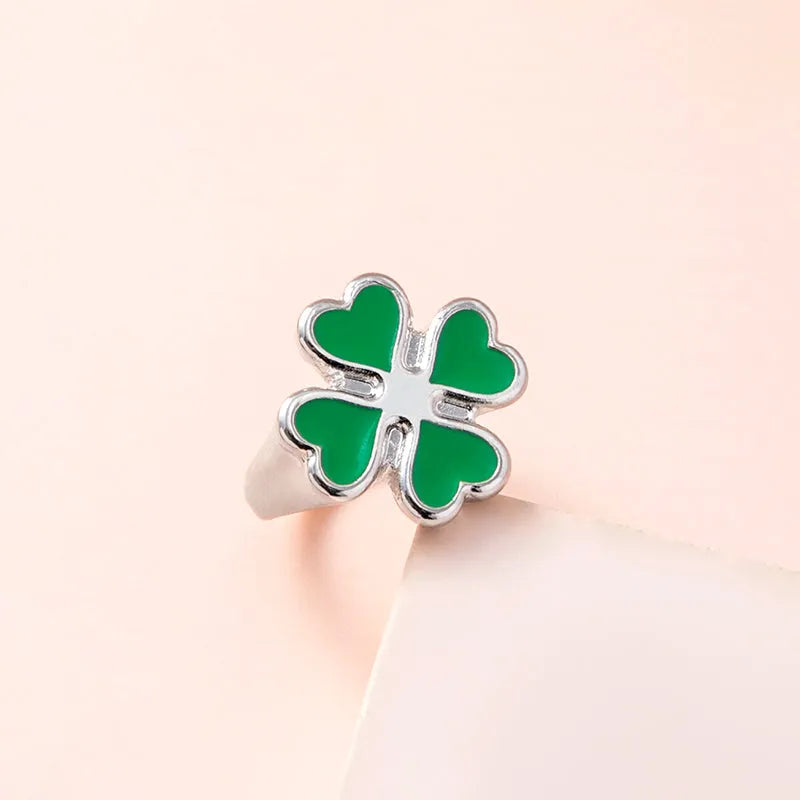 Four leaf clover ring in silver colour with enamel detailing on zinc alloy band, 17mm size