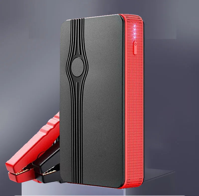 Red K4-E automobile emergency starting power supply unit with USB port and clamps for vehicle jump-starting