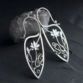 Silver electroplated lotus vine earrings with floral design and geometric round elements