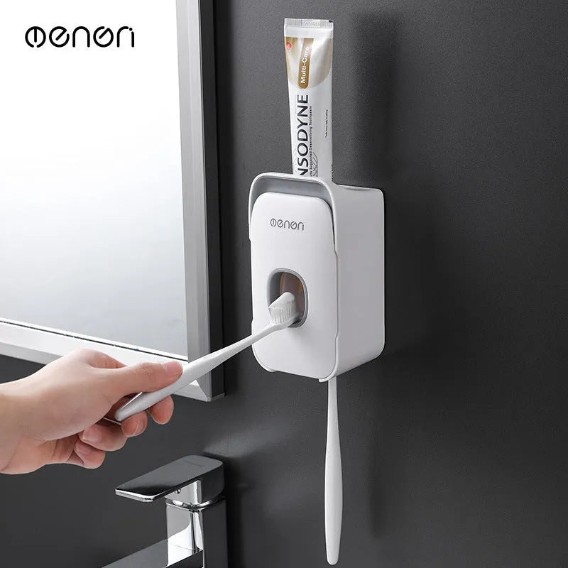 Automatic toothpaste dispenser mounted on bathroom wall in blue colour