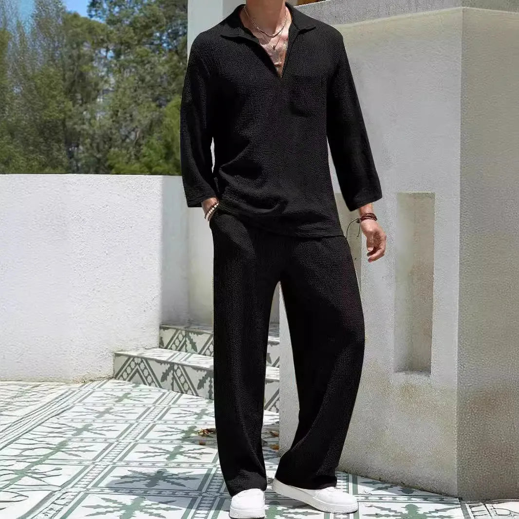 Man wearing a lake blue casual shirt and matching trousers from a polyester suit set.