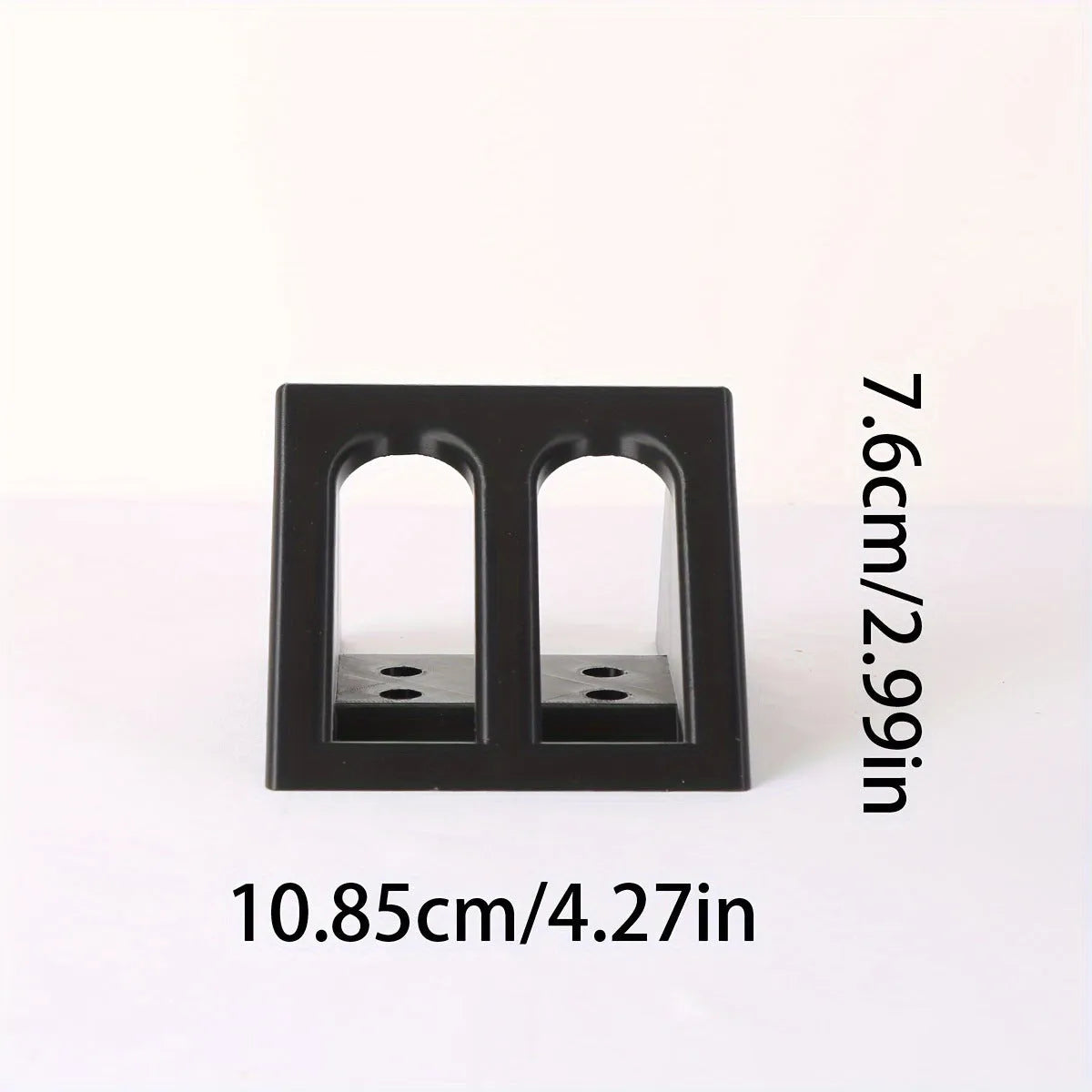 Black punk-style plastic pistol stand for airsoft gun display