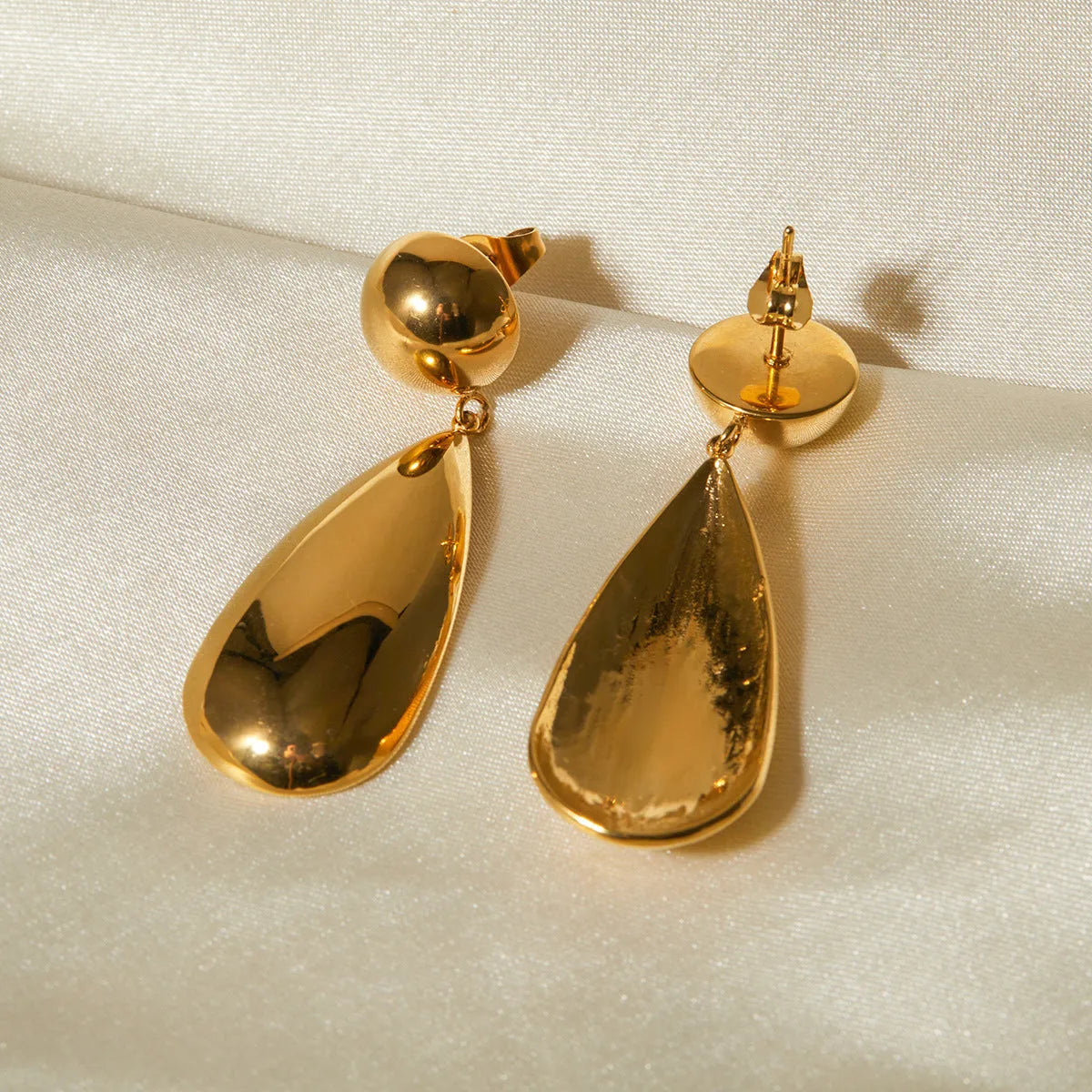 Gold stainless steel water drop earrings with geometric hemisphere pendants for women