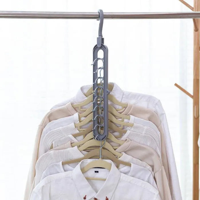 Plastic clothes hanger with rotating hook in assorted colours on white background