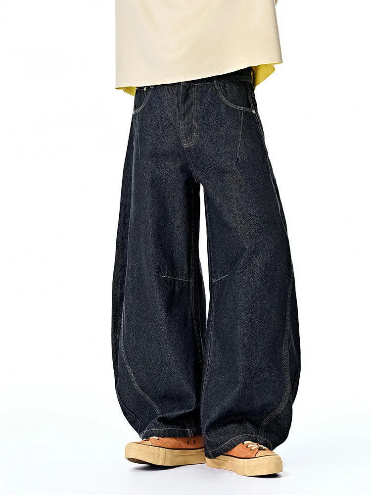 Men's wide leg denim trousers in original cow colour showing mid-waist design and cotton fabric