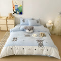 Schnauzer dog cartoon embroidered cotton bedding set with quilt cover, sheet, and pillowcases on a bed.